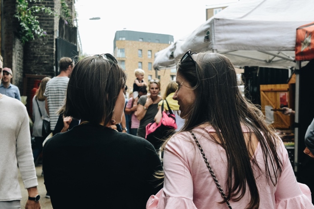 Two women enjoying a local street market