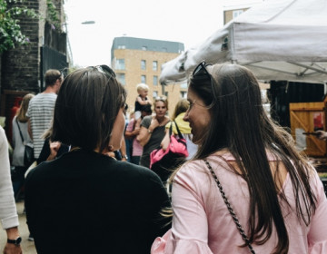 Two women enjoying a local street market